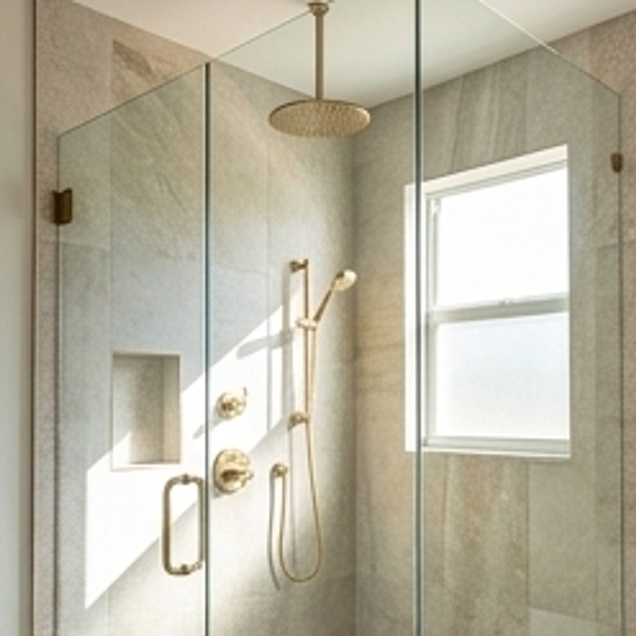custom shower featuring elegant fixtures