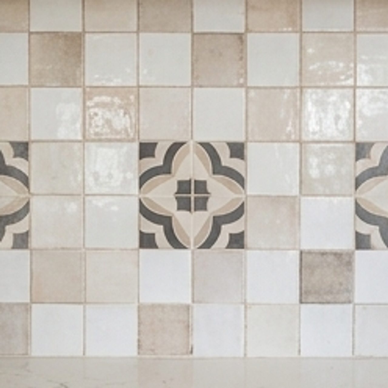 closeup of backsplash tiles with brand colors